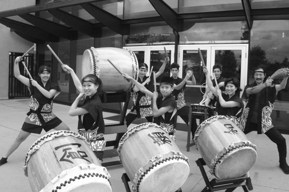 Members of Chibi Taiko pose with drums and sticks in hand